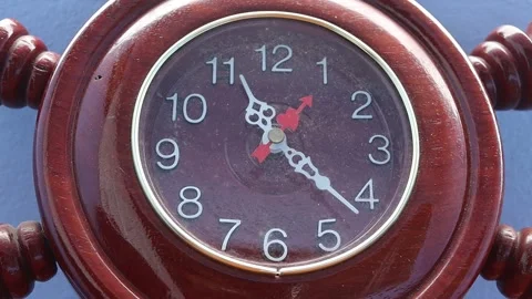 Clock is precision made from teak wood case, white pointer Stock Footage 141306813