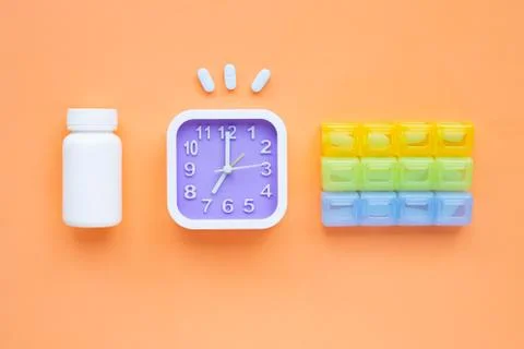 Clock with "PrEP" ( Pre-Exposure Prophylaxis). used to prevent HIV on orange  Stock Photos
