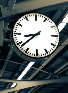 Clock in railway station Stock Photos
