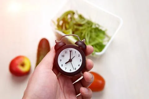 Clock in restaurant, abstract background.for time for diet concept. Stock Photos