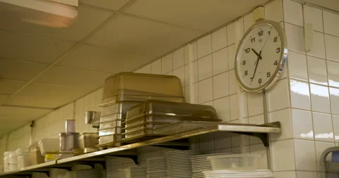 Clock in a restaurant kitchen Stock Footage