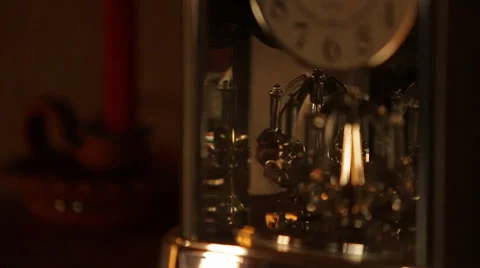 Clock with rotating crystal pendulum. Close up Stock Footage 38145623