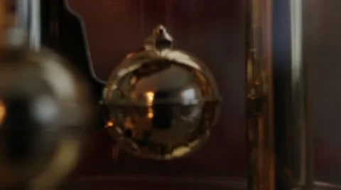 A clock with rotating Pendulums Stock Footage 11401403