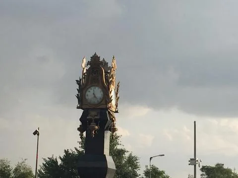 Clock Round About Stock-Fotos