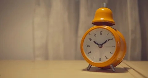 Clock With Round Dial. Alarm Clock Is Orange Video stock 127694001