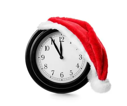 Clock with Santa hat on white background. Christmas countdown 스톡 사진