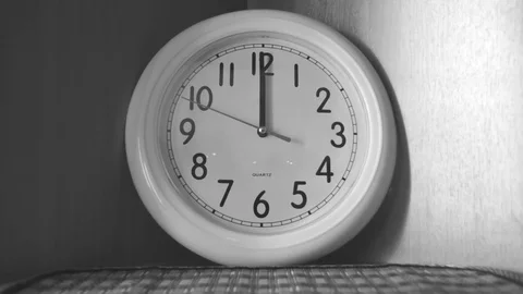 Clock is on the shelf black and white Vidéo 77284029