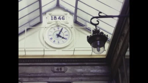Clock showing time passing inside passage verdeau in paris france Stock Footage 291043971