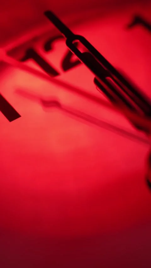 The clock shows the mystical time - 00:00. Midnight. The red light. 12 o'clock. Stock Footage 293138159