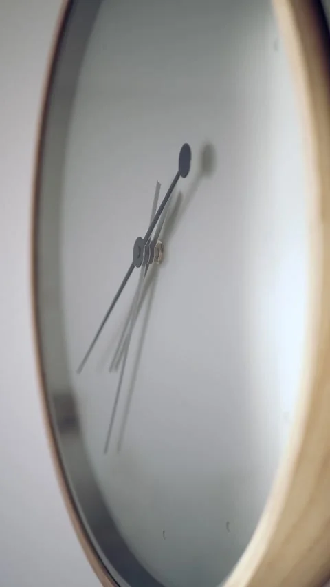 Clock shows time in close-up view on a wall 库存影片 345101901