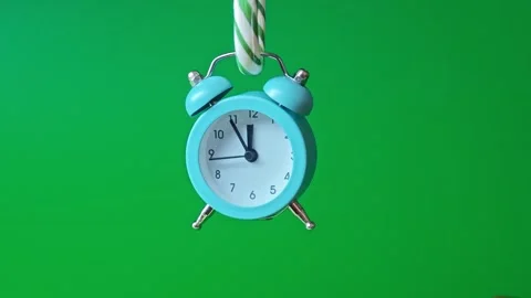 Clock shows time with different angles on a green background Stock Footage 340461914