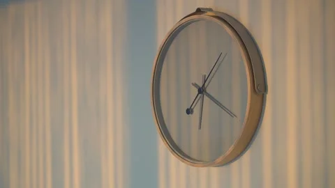 Clock shows time with light reflections on the wall Stock Footage 337945231