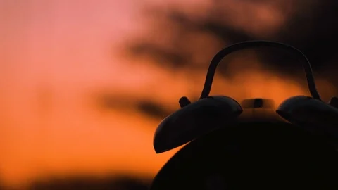 Clock Silhouetted on a Sunset Stock Footage 91552682