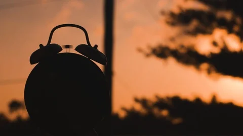 Clock Silhouetted on a Sunset Stock Footage 91552743