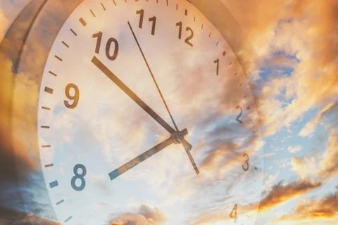 Clock in sky Stock Photos