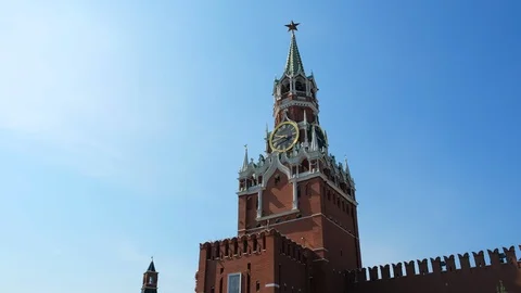 The clock on Spasskaya Tower of the Kremlin against the blue sky on a sunny Stock Footage 110161611