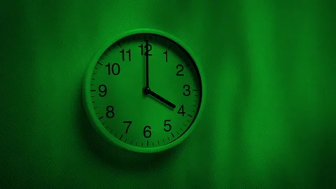 Clock In Spooky Green Light With Tree Shadows Stock Footage 321029924
