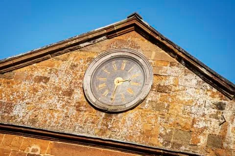 Clock on the stable wall, reading 2.30 pm Stock Photos