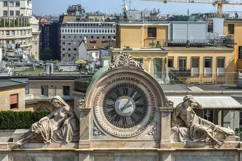 Clock with statues Stock Photos