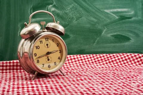 Clock at table Stock Photos
