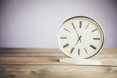 Clock in table Stock Photos
