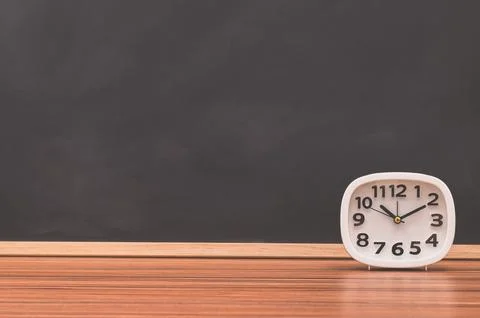 The clock on the table Stock Photos