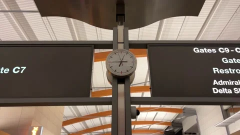 Clock tilting down to empty RDU Raleigh Durham Airport in North Carolina Stock Footage 162318433