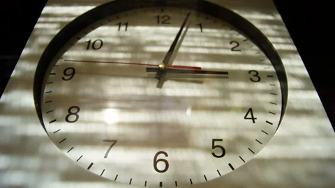 Clock time lapse with lights and shadows static stock footage Stock Footage 135892540