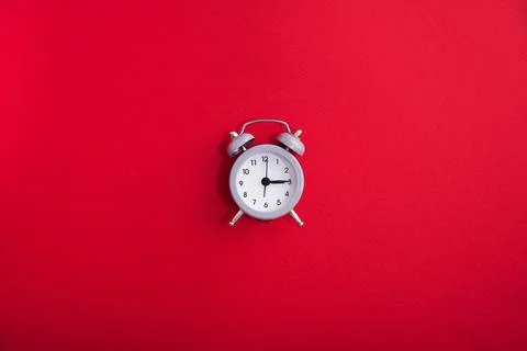 Clock time on a red bright background Stock Photos