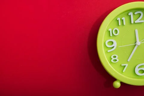Clock time on a red bright background Stock Photos