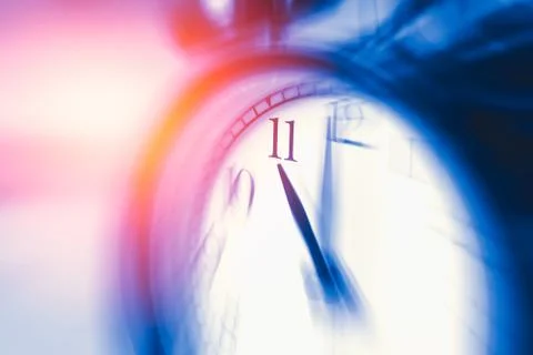 Clock time with zoom motion blur focus at 11 o'clock, fast speed business h.. Stock Photos