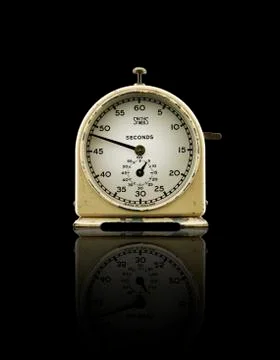 Clock timer with reflection on black background. Stock Photos