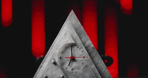 A clock is on top of a pyramid shaped structure Stock-Footage 296097395