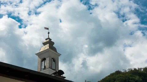 Clock tower against Moving Clouds Stock Footage