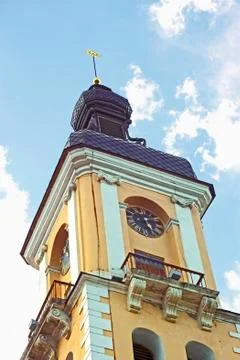 Clock tower against sky with clouds Stock Photos