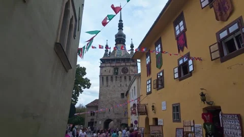 The Clock Tower along the Vlad Dracula House in the historical town center of Stock Footage 319645865