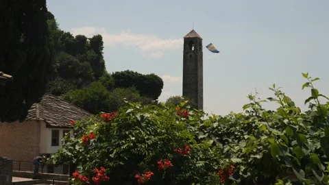 Clock Tower and Bosnian Flag, Pocitelj, Bosnia and Herzegovina Stock Footage 236043328