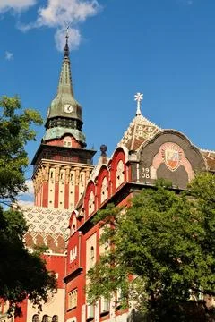Clock tower and upper facade of the city hall, town hall on a sunny day, an e Stock-Fotos