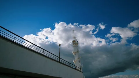 Clock tower on a background of clouds Stock Footage 107824731