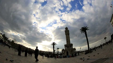 Clock tower, beautiful clouds and crowded pedestrian at city square smyrna Turke Stock Footage 34230731