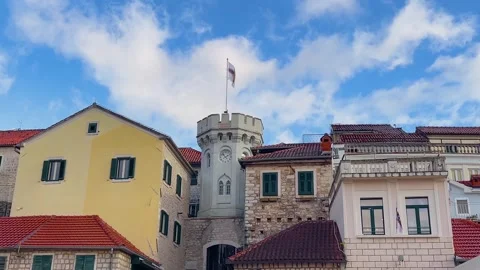 Clock tower between old stone houses in Herceg Novi old town Stock Footage 339717185