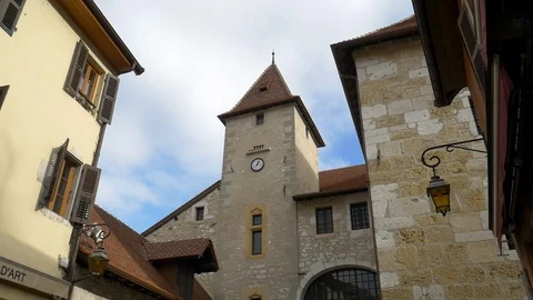 Clock tower in between of other buildings in Annecy, France Stock Footage 99182696