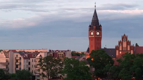 Clock tower birds flying around skyline evening Köpenick Berlin Germany Stock Footage 145911483