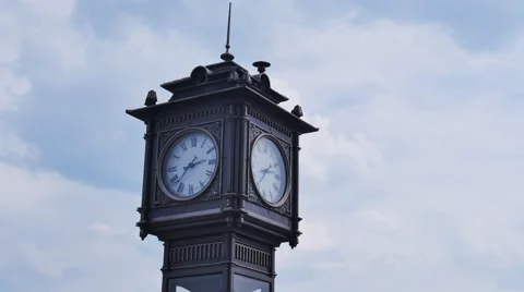 The clock tower in the city, on a background of clouds, timelapse Stock Footage 64172442