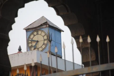 Clock tower in a city Stock Photos