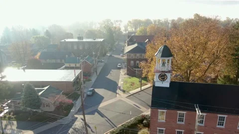 Clock tower on colonial restored brick building in small town America. Video stock 149470136