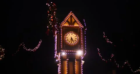 Clock Tower covering Christmas lights at night Stock Footage 232287452