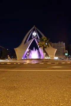 Clock tower dubai at night Stock Photos