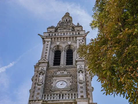 The clock tower of Église Saint-Benoît on a summer's day Stock Photos