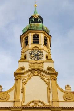 Clock tower of famous historical Loreta building in Prague, Czech Republic Stock Photos